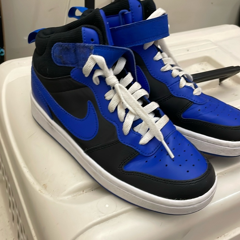 Blue and black Nike high top shoes